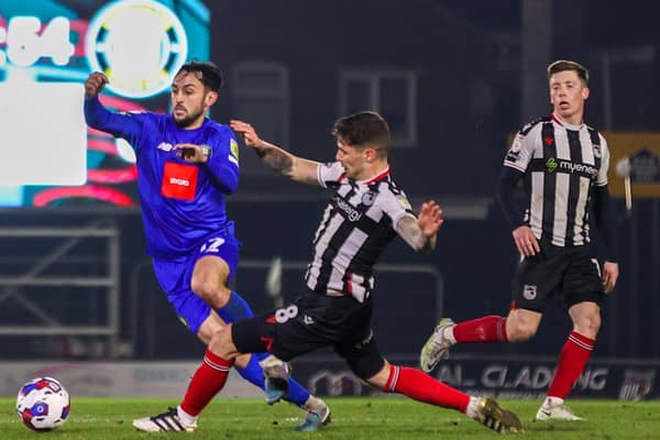 Levi Sutton in action for Harrogate Town during Tuesday night's 0-0 draw with Grimsby Town at Blundell Park. Pictures: Matt Kirkham