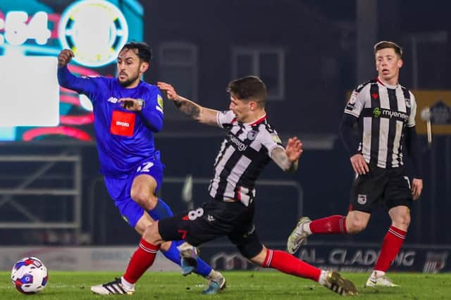 Levi Sutton in action for Harrogate Town during Tuesday night's 0-0 draw with Grimsby Town at Blundell Park. Pictures: Matt Kirkham