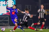 Levi Sutton in action for Harrogate Town during Tuesday night's 0-0 draw with Grimsby Town at Blundell Park. Pictures: Matt Kirkham