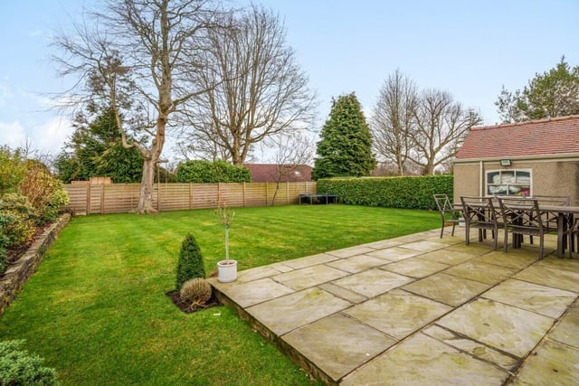 The lawned rear garden with patio area.