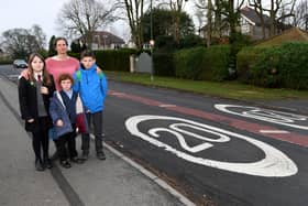 Pannal Ash Safe Streets Zone campaigner Jenny Marks with her daughters, from left, Ruth Lily's daughter Elsa Lily, aged 12,  and Jenny's Emma Marks aged six and Sam Marks aged 11 on Pannal Ash Road in Harrogate. (Picture Gerard Binks)