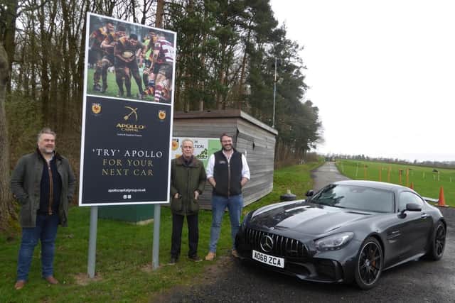 Mark Garret, Chairman at Harrogate RUFC, Mike Cowling, Commercial Chairman at Harrogate RUFC and David Moss, Managing Director of Apollo Capital, with one of the new signs outside the Apollo Capital Stadium