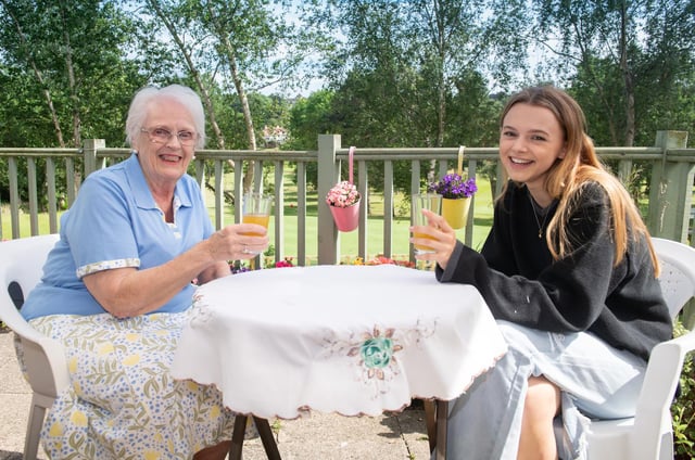 Sophie Westwood, 17, is part of the phone call support group with Pat McArthur, 83, a former school teacher.
