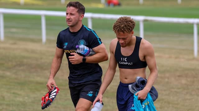 Harrogate Town Director of Youth Football Josh Falkingham, left, heads off the training field with Stephen Duke-McKenna following the conclusion of a pre-season fitness session. Picture: Matt Kirkham