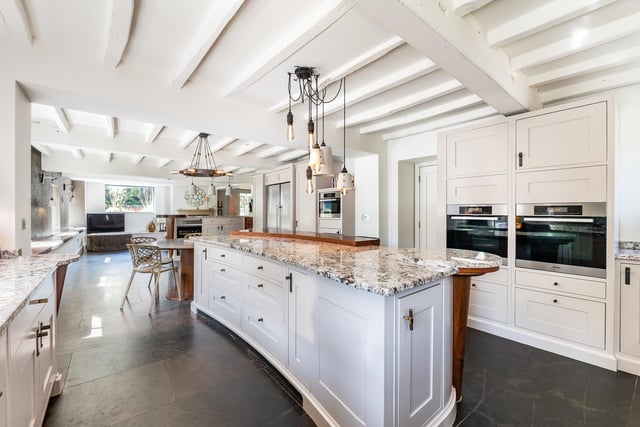 The high spec, open plan dining kitchen is bright and spacious.
