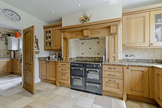 The kitchen with fitted units, granite worktops and a range cooker.