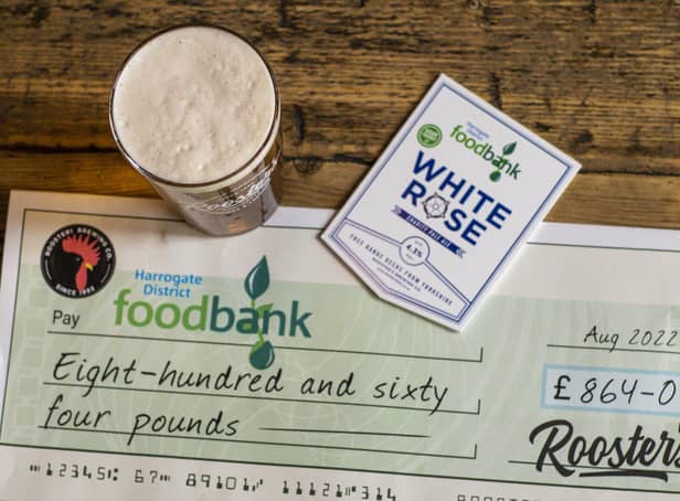 Rooster's of Harrogate has donated a cheque from sales of its White Rose charity beer to Harrogate District Foodbank.
