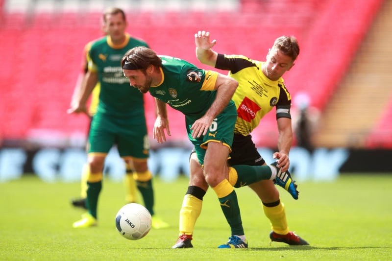 Notts County's Jim O'Brien (left) and Harrogate Town's Josh Falkingham (right) battle for the ball during the play-off final