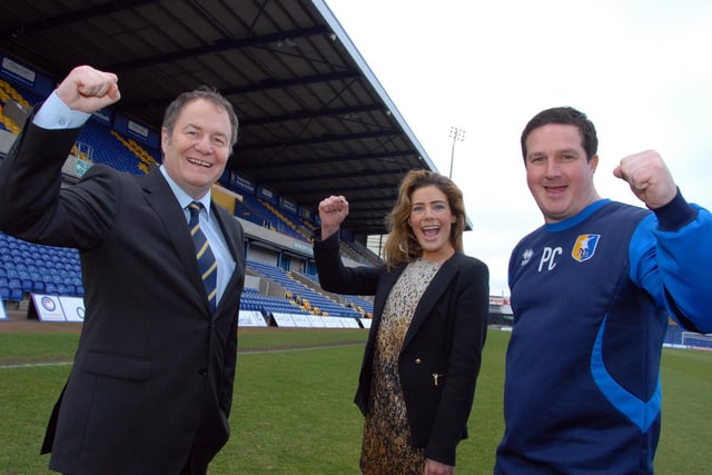 Chairman John Radford, Chief Executive Officer Carolyn Stills and manager Paul Cox celebrate success. It was this trio who laid the foundations on and off the pitch for Mansfield's Blue Square Premier title-winning season and a long-awaited Football League return.