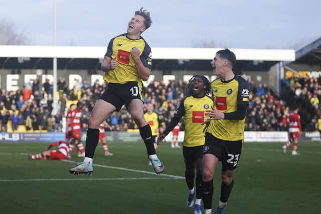 Harrogate Town winger James Daly celebrates after finding the back of the net against Doncaster Rovers. Picture: Paul Thompson/ProSportsImages
