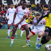 Harrogate Town forward Abraham Odoh finds his route to goal blocked by the Walsall defence. Pictures: Matt Kirkham