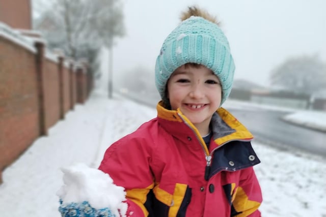 Zac (aged six) wrapped up and enjoying the snow