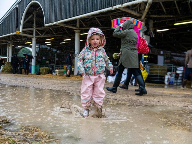 Reeve Gobby, aged three, of Selby, is one of the few visitors enjoying the wet weather on the first day of this year's show