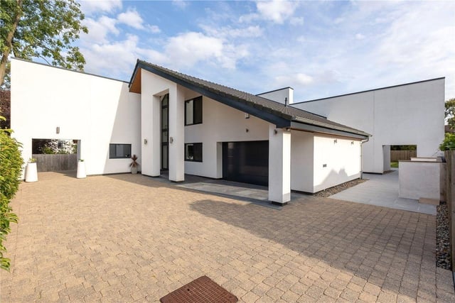 This four bedroom and three bathroom detached house is for sale with Strutt & Parker for £1,700,000