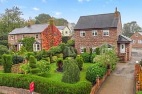 The detached house with its attractive front garden, and side driveway, has a village location.