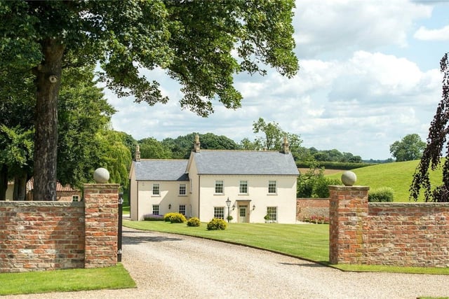 This five bedroom and four bathroom detached house is for sale with Savills for £5,950,000