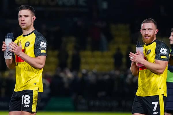 Jack Muldoon, left, and George Thomson applaud the Harrogate Town faithful following Boxing Day's 2-1 home win over Accrington Stanley. Pictures: Malcolm Bryce/ProSportsImages