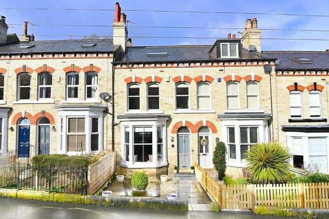 The attractive frontage of the mid-terrace property includes a paved garden.