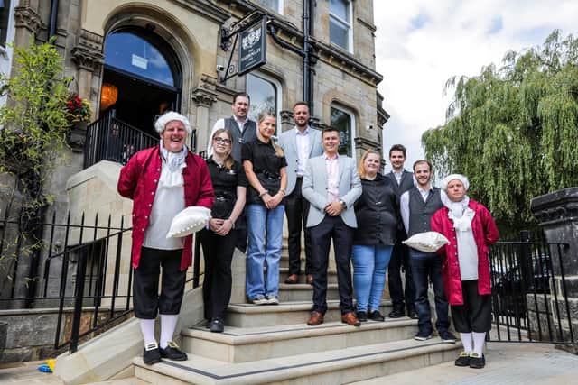 Welcome to the Harrogate Inn - The team at what was St George Hotel greeting guests at The Harrogate Inn and the new Barking George bar restaurant. (Photograph Stuart Boulton/The Inn Collection)