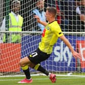 Max Wright opens the scoring early on in Harrogate Town's 2-2 pre-season friendly draw with Barnsley. Pictures: Matt Kirkham