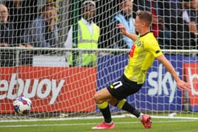 Max Wright opens the scoring early on in Harrogate Town's 2-2 pre-season friendly draw with Barnsley. Pictures: Matt Kirkham