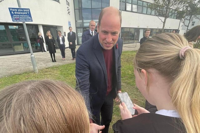 Georgia Smith, 16, and sister Layla, 12, meet William, the Prince of Wales this morning.