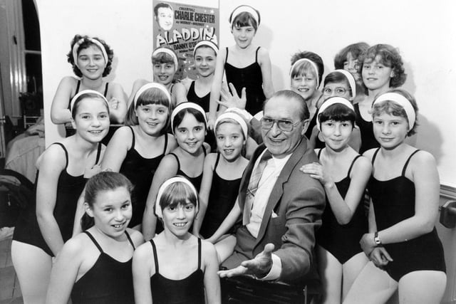 Comedian and broadcaster Charlie Chester with the Katrina Hughes Dancers, who starred with him in the pantomime "Aladdin" at Harrogate Theatre in 1983