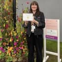 Harrogate florist Helen James with her gold medal award winning floral display at the RHS Chelsea Flower Show