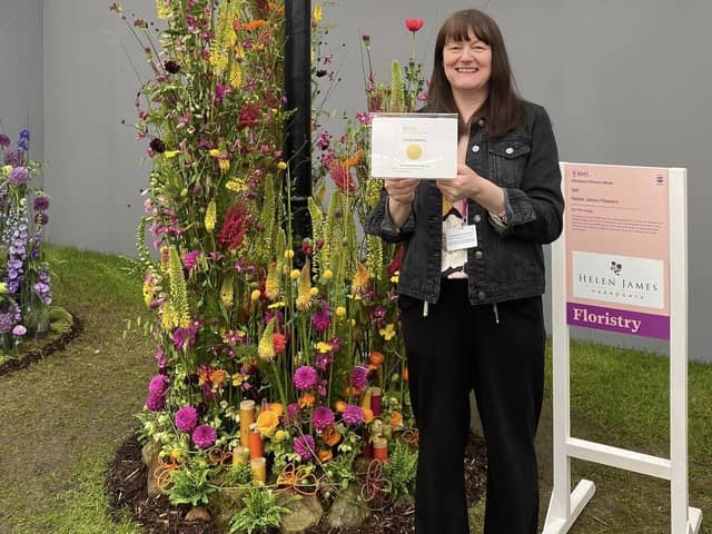 Harrogate florist Helen James with her gold medal award winning floral display at the RHS Chelsea Flower Show