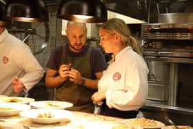 Abi cooking under the watchful eye of chef Tom Cenci in a previous round. Photo: BBC/Shine TV