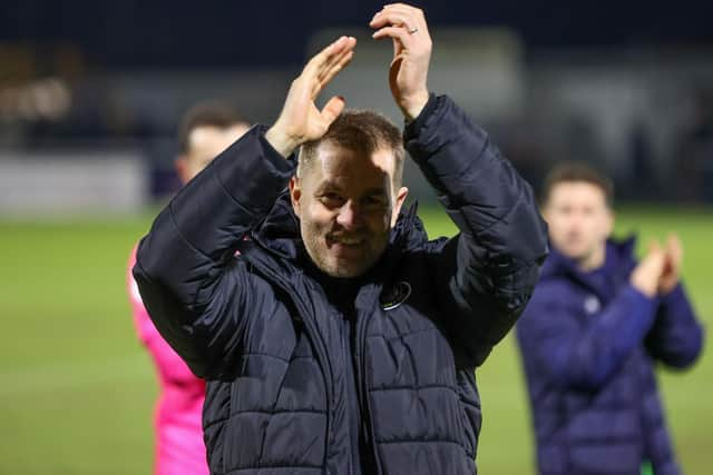 Simon Weaver celebrates with Harrogate Town's travelling fans after his side beat Sutton United in midweek to record their sixth victory in eight matches. Picture: Matt Kirkham