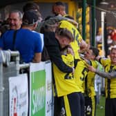 Harrogate Town players celebrate their last-gasp winner during Saturday's victory over Carlisle United. Pictures: Matt Kirkham