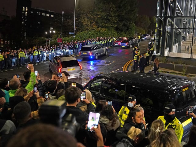 People watch the former US president Barack Obama leave the University of Strathclyde in Glasgow during the Cop26 summit.
