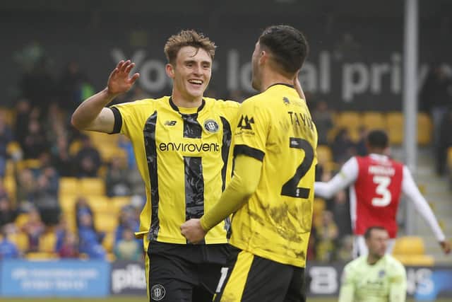 Tom Cursons, left, and Ellis Taylor celebrate after the latter set the former up to fire the Sulphurites into a 3-1 lead against Fleetwood.