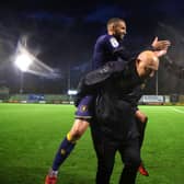 Jordan Bowery of Mansfield Town celebrates victory with manager Nigel Clough. (Photo by Michael Steele/Getty Images)