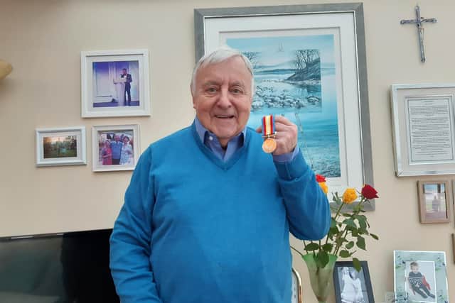 RAF veteran, the The Revd John Walden, in his home in Starbeck in Harrogate holding The Nuclear Test Medal from the Ministry of Defence. (Picture Graham Chalmers)