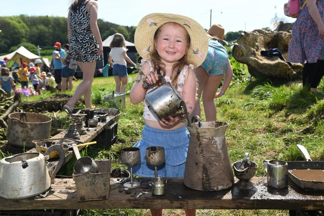 Matilda Cooke (aged three) enjoying getting muddy in the Forest School at the festival