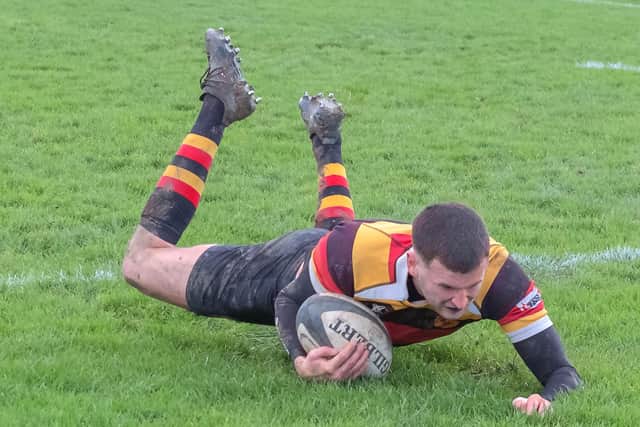 Tom Steene dives over the whitewash to register Harrogate's only try of the game.