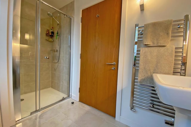 A modern, walk-in shower room facility.