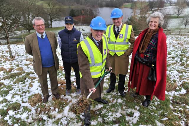 Nick Bannister, second from right, with his parents and son preparing for the building of the hotel's spa
