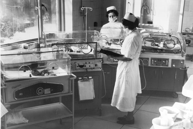 Nurses attend to babies in incubators in the special baby care wing of Harrogate Hospital in 1970