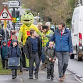 ​Students from Hookstone Chase Primary School taking part in a Walk To School event with Harry Gator, Harrogate Town mascot.