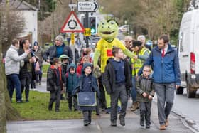 ​Students from Hookstone Chase Primary School taking part in a Walk To School event with Harry Gator, Harrogate Town mascot.