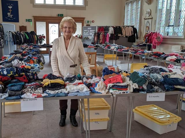 Margaret with some of the items on offer at Thirsk Salvation Army's Kids Community Wardrobe