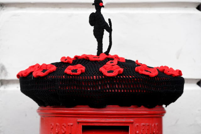 Poppies decorate post box outside Ripon Town Hall.
