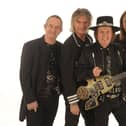 Slade today: Founder member Dave Hill on lead guitar, second from right, with John Berry on lead vocals, bass, acoustic guitar and violin; Russell Keefe on lead vocals and keyboards and new drummer Alex Bines.