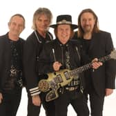 Slade today: Founder member Dave Hill on lead guitar, second from right, with John Berry on lead vocals, bass, acoustic guitar and violin; Russell Keefe on lead vocals and keyboards and new drummer Alex Bines.