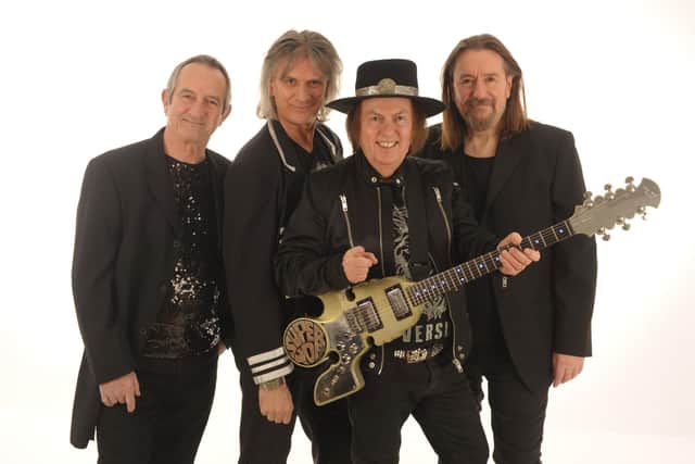 Slade today: Founder member Dave Hill on lead guitar, second from right, with John Berry on lead vocals, bass, acoustic guitar and violin; Russell Keefe on lead vocals and keyboards and new drummer Alex Bines.