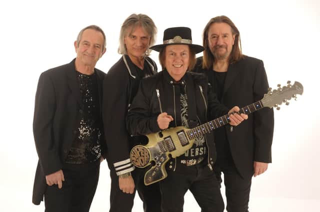 Slade today: Founder member Dave Hill on lead guitar, second from right, with John Berry on lead vocals, bass, acoustic guitar and violin; Russell Keefe on lead vocals and keyboards and new drummer Alex Bines.