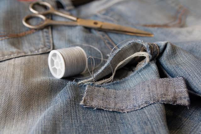 Sew a rip in clothing rather than replace the item (photo: Adobe)
